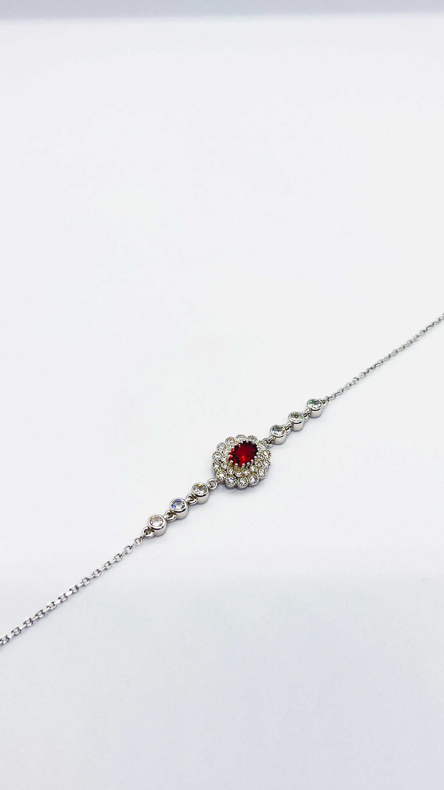 Simple bracelet with red & transparent zircon stones