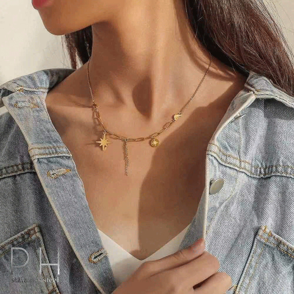 Gold chain necklace with a star