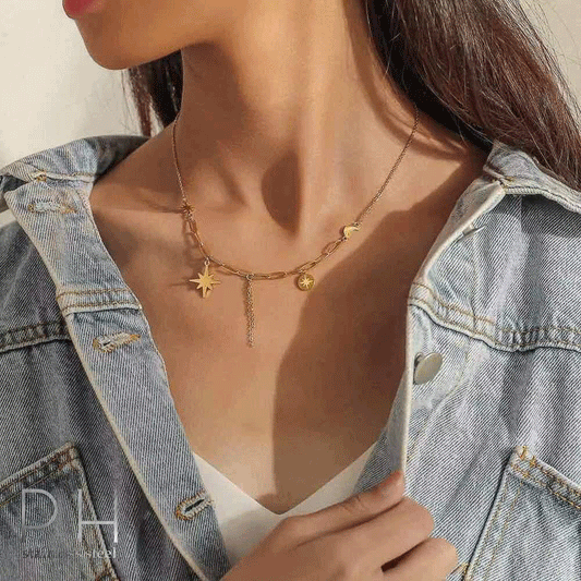Gold chain necklace with a star