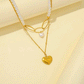 Golden heart necklace with pearls